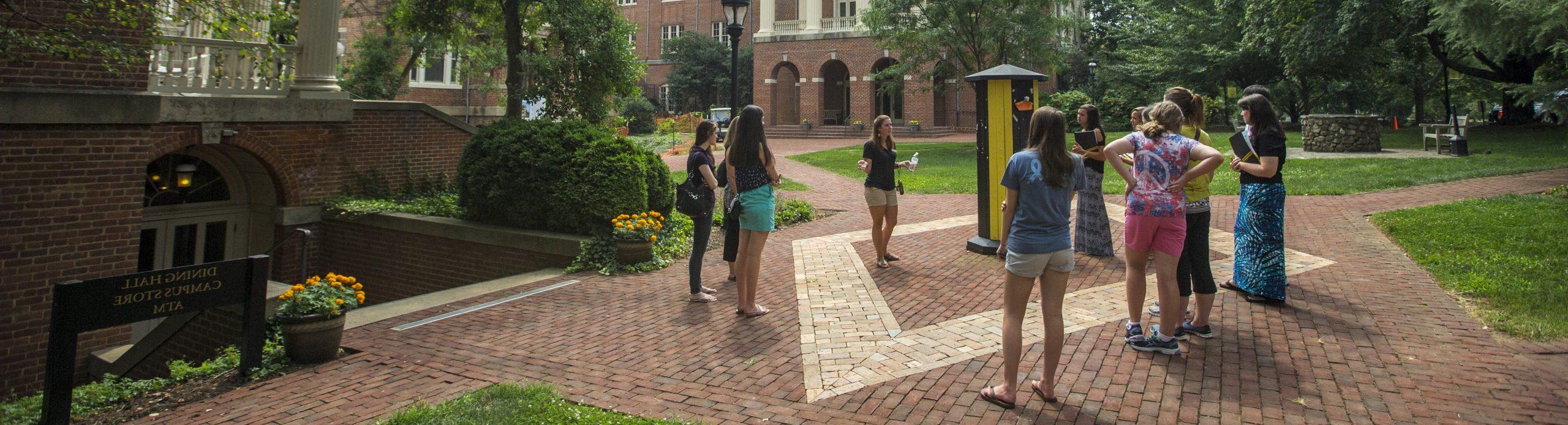 Photo of students talking a tour of campus